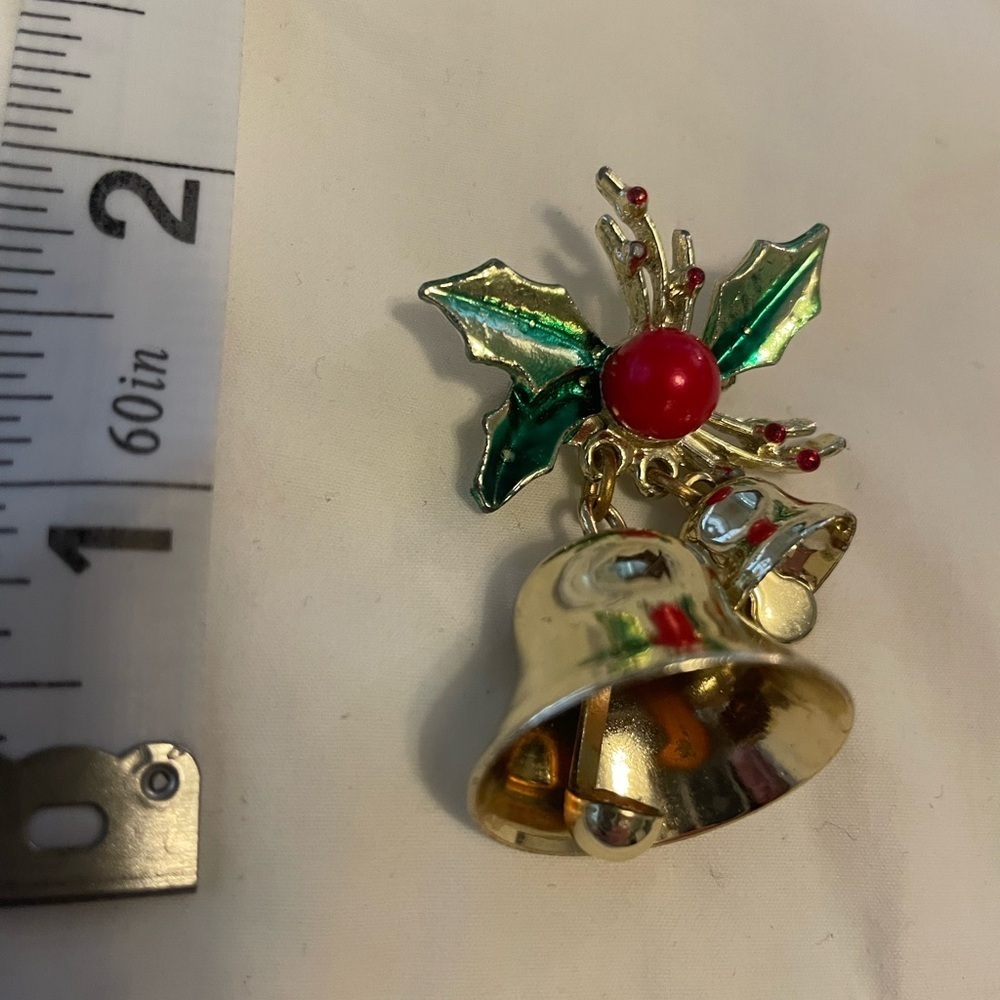 Vintage pin with gold bells that jingle and Holly
